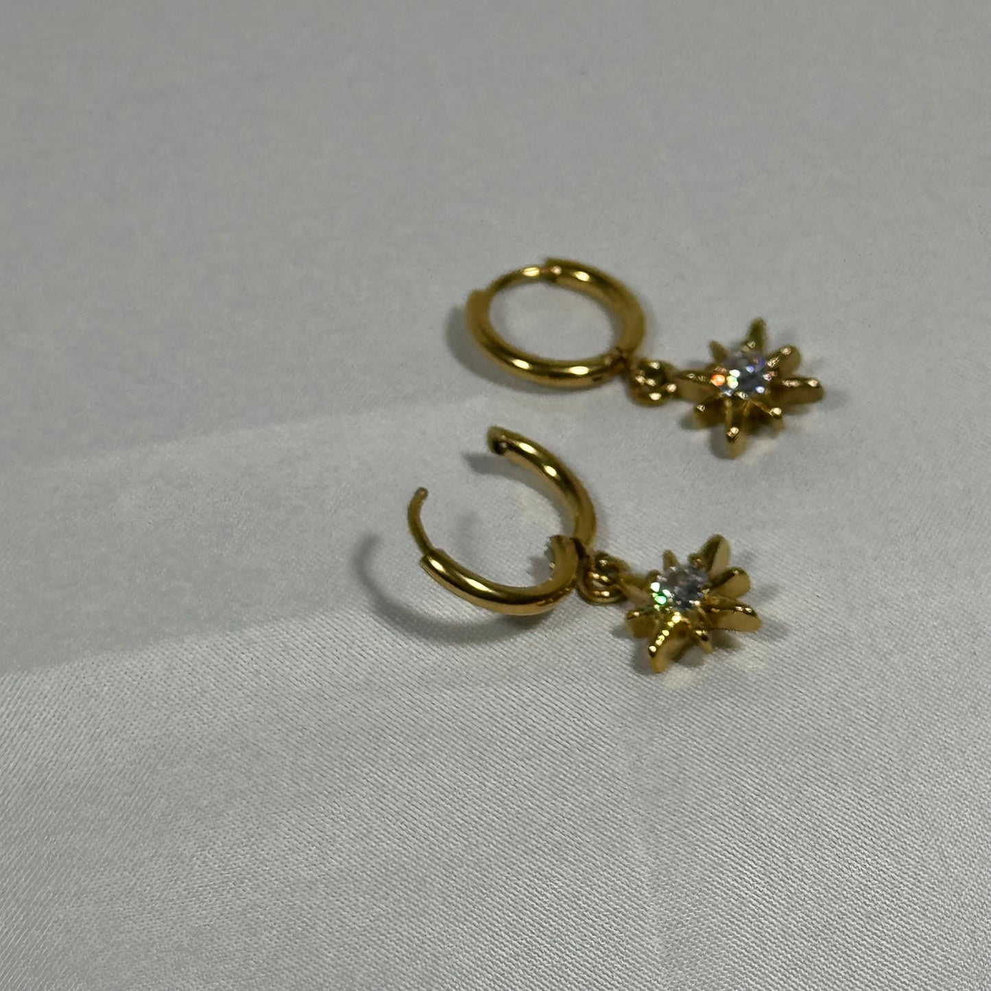 Saffron sun huggie earrings