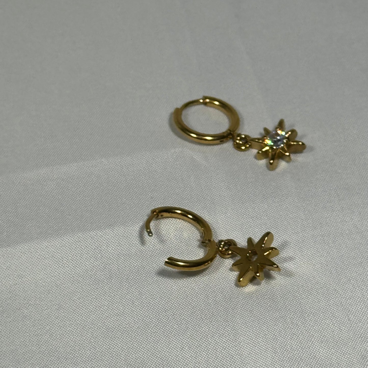 Saffron sun huggie earrings